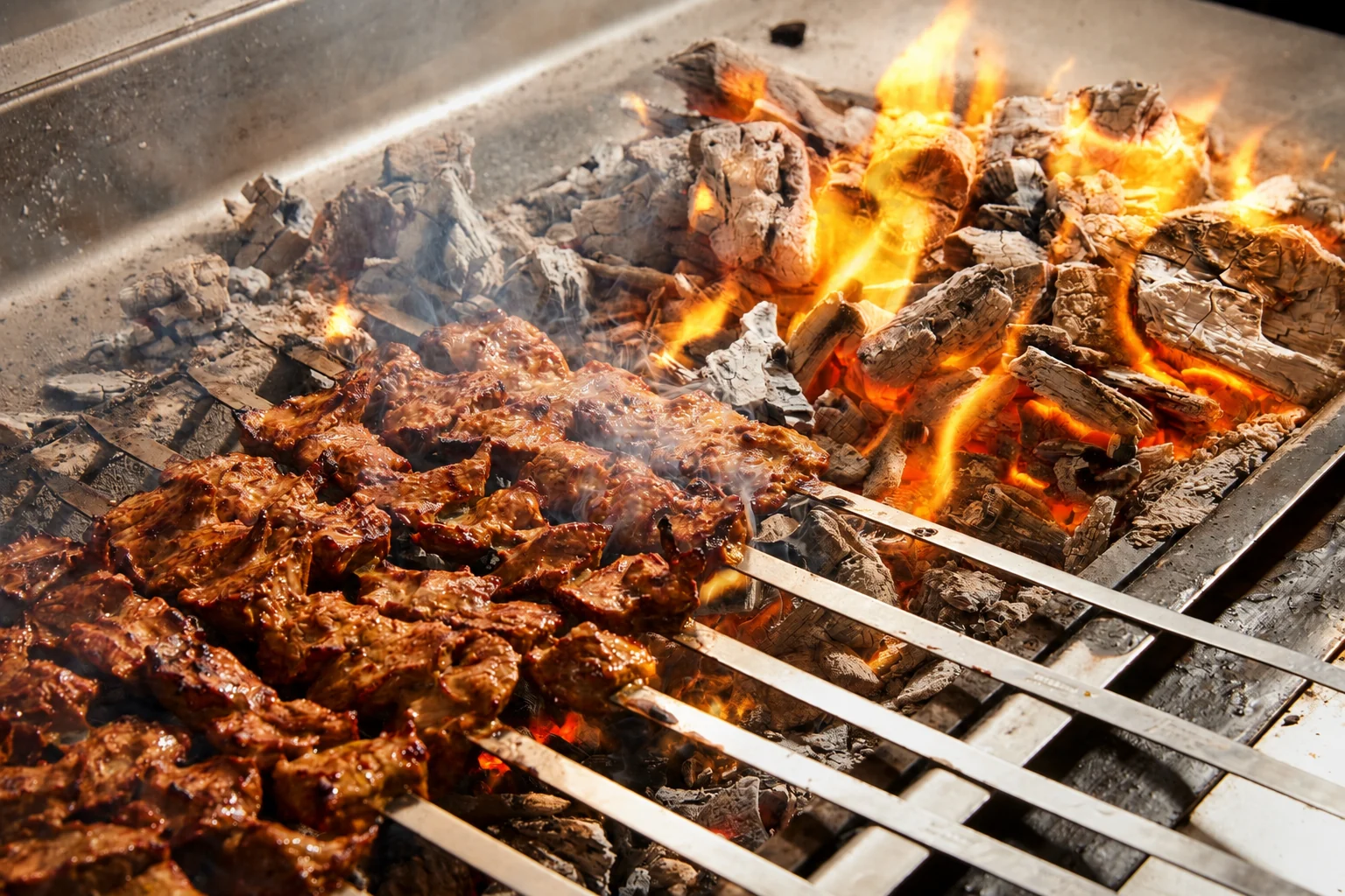 Grill Hut skewers grilling over open flame