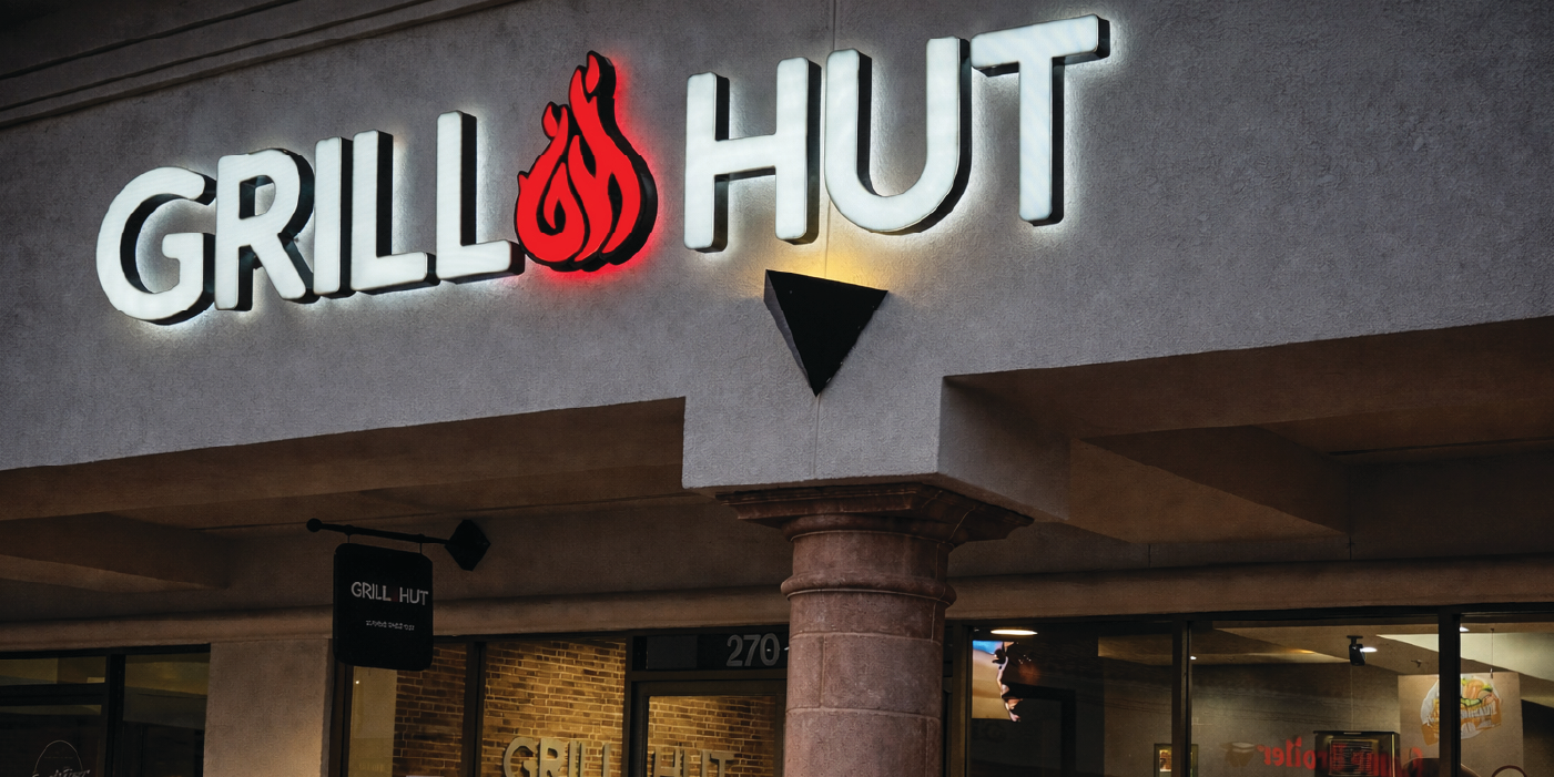 Grill Hut exterior signage at night