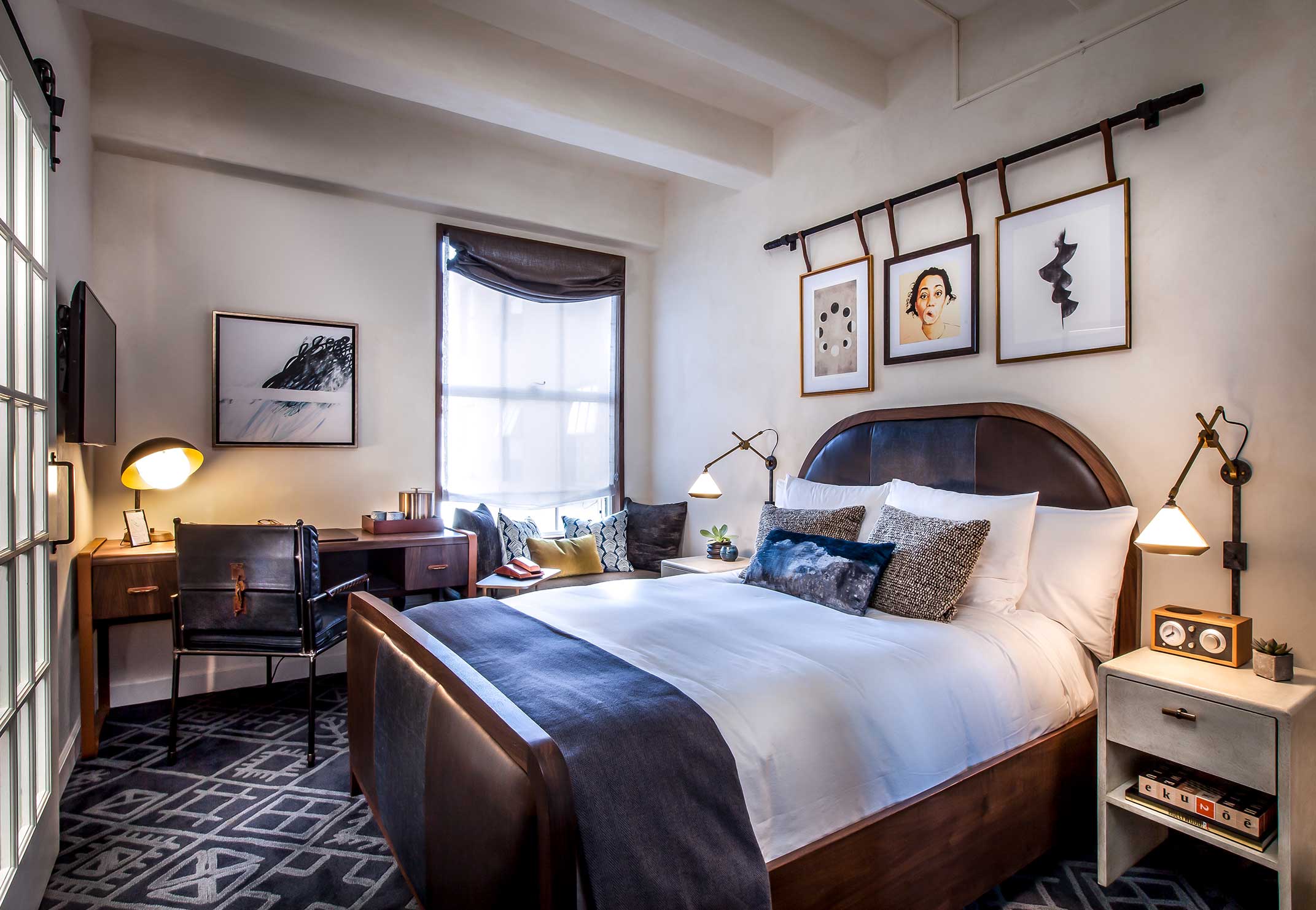 Hotel Figueroa guest room with custom furniture and layered textiles